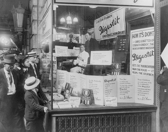 Shoppers Looking at Window Display of Brown's Drug Store